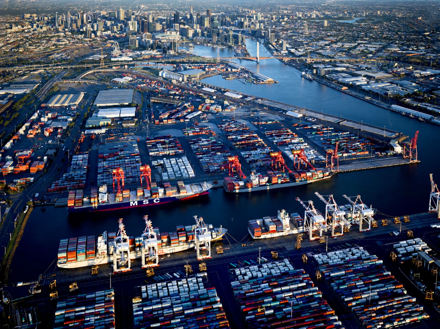 Port of Melbourne container terminal and city skyline
